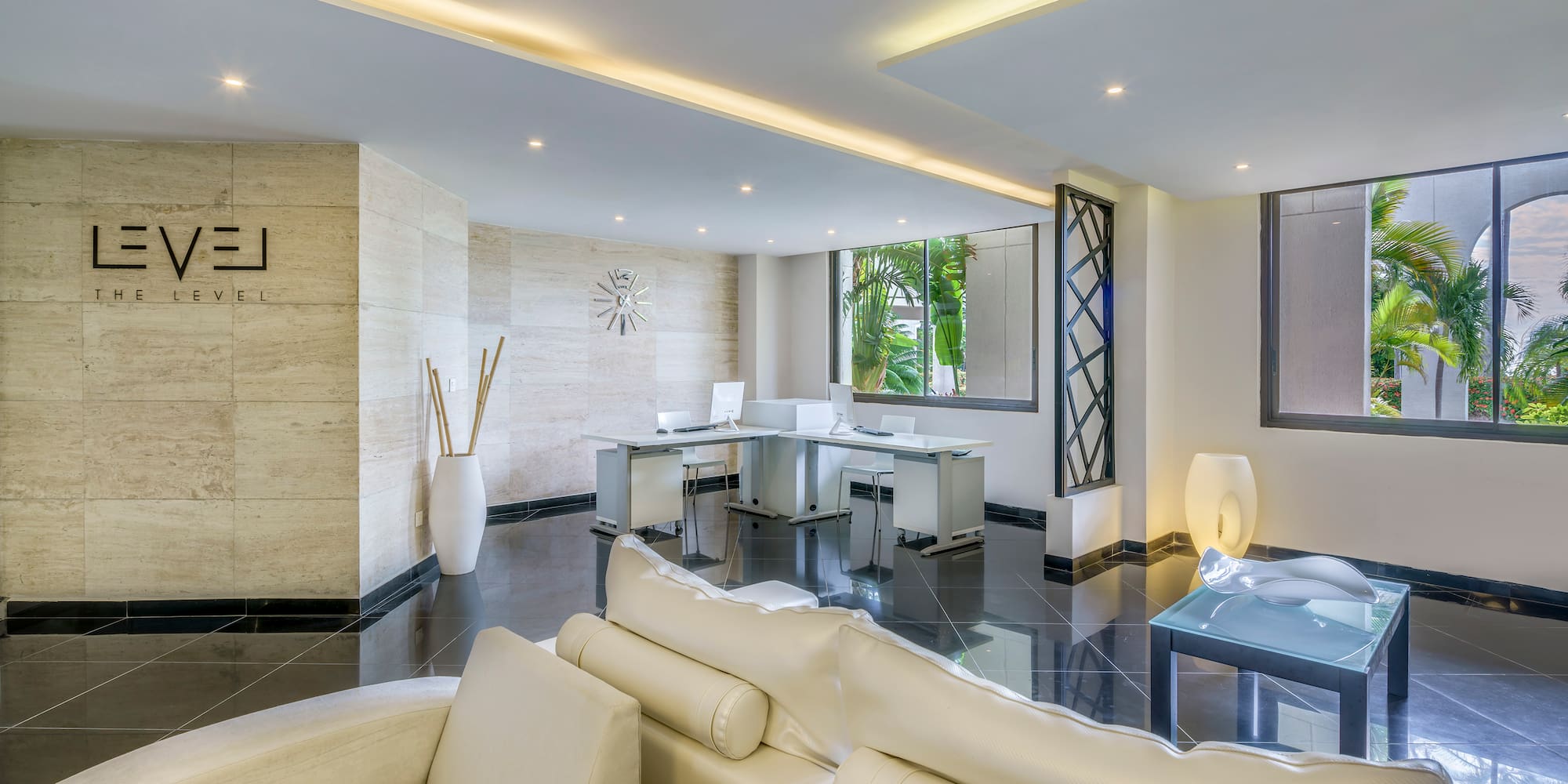 a room with white furniture and a black floor