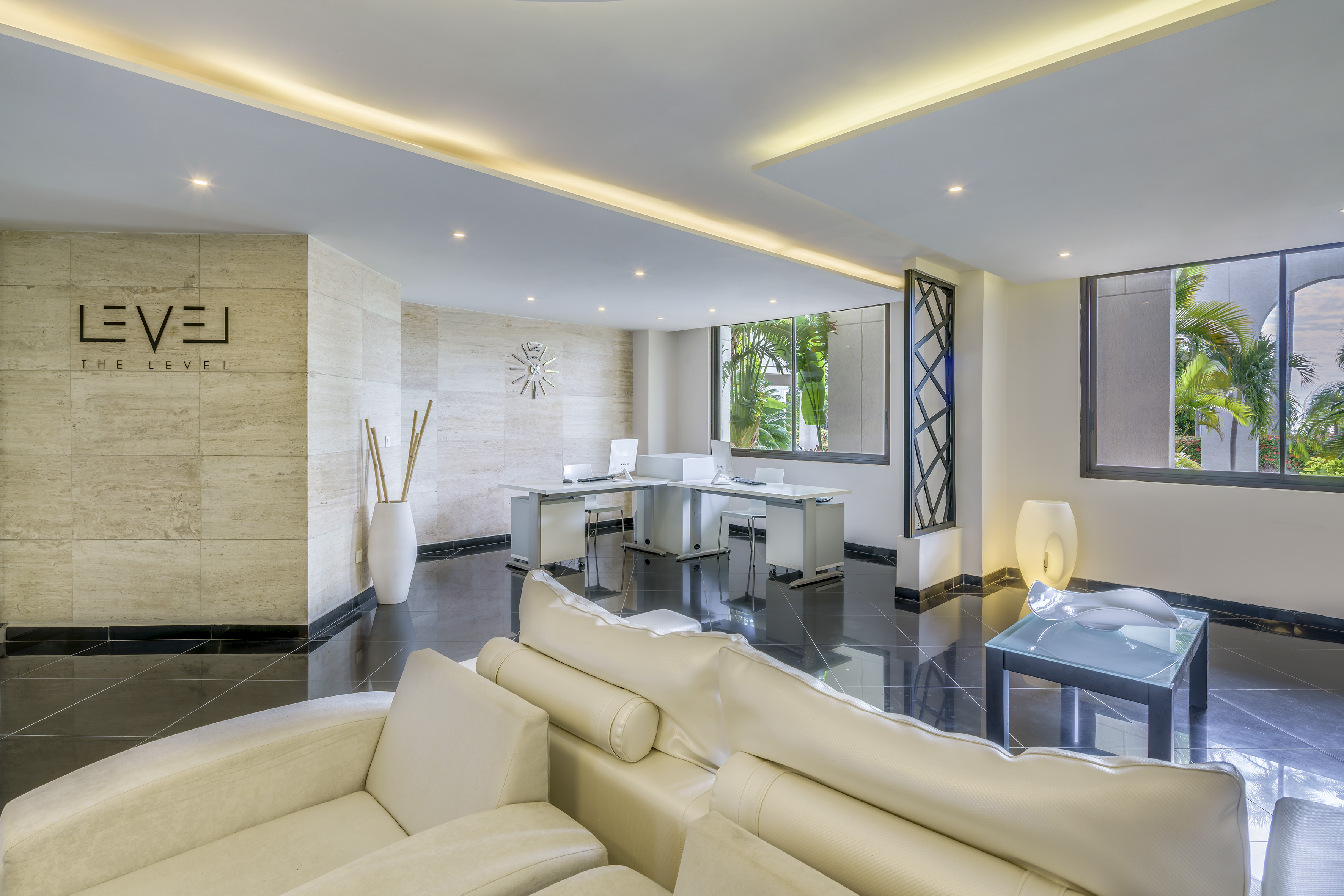 a room with white furniture and a black floor