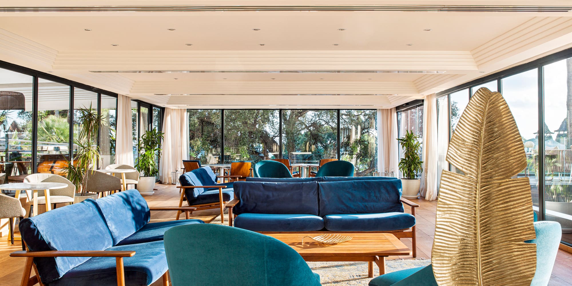 a room with blue couches and a table