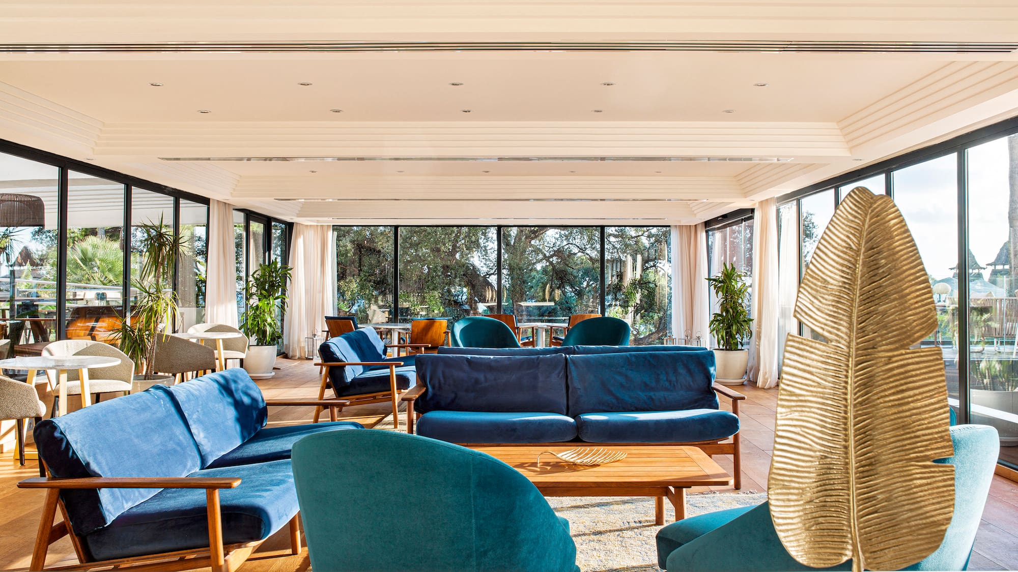 a room with blue couches and a table