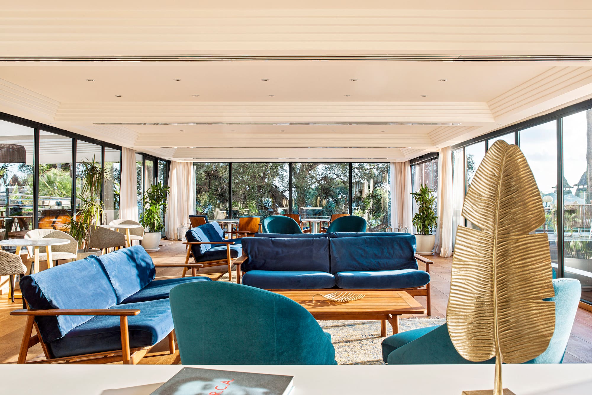 a room with blue couches and a table