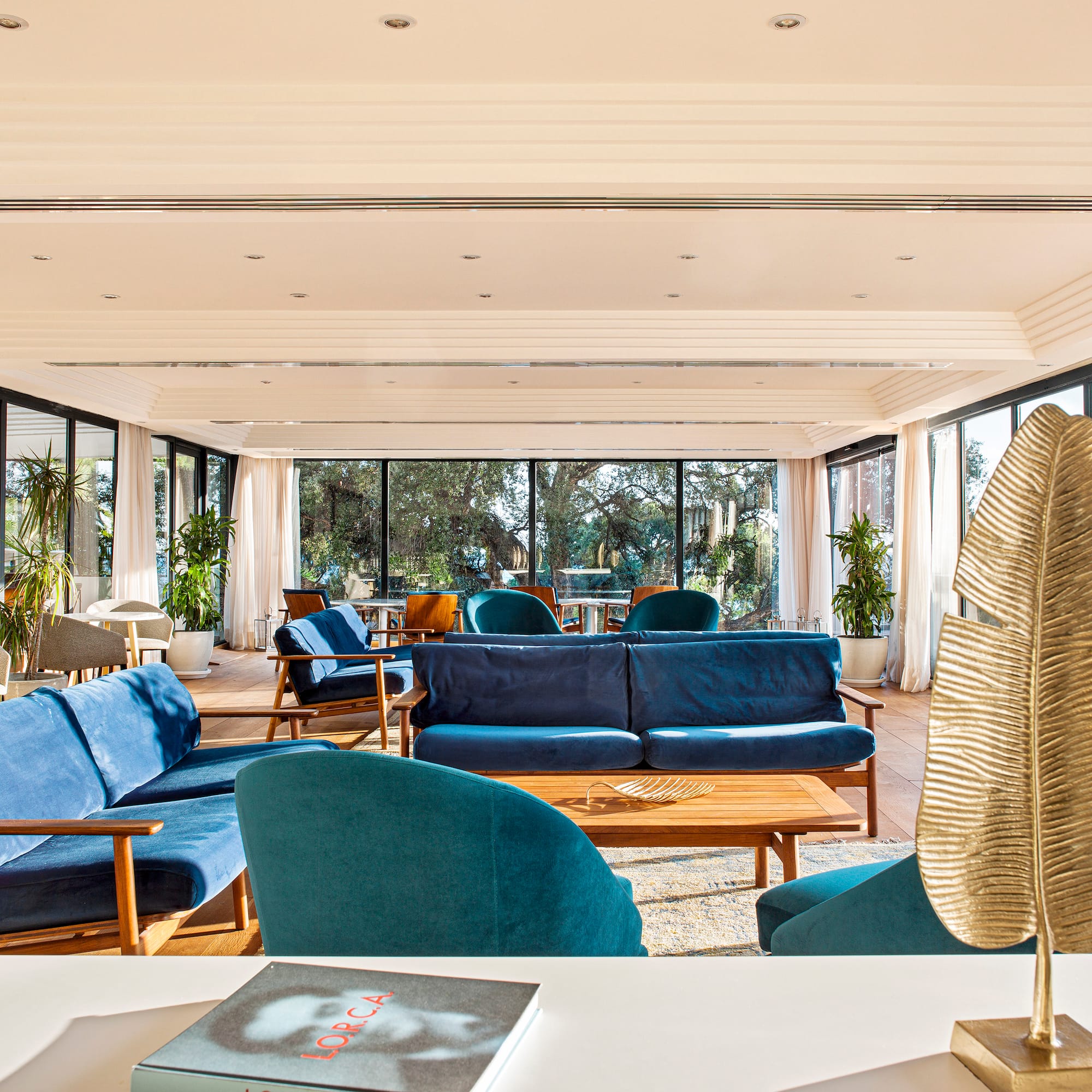 a room with blue couches and a table