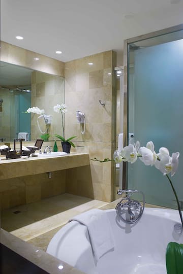 a bathroom with a bathtub and sink