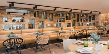 a restaurant with tables and chairs