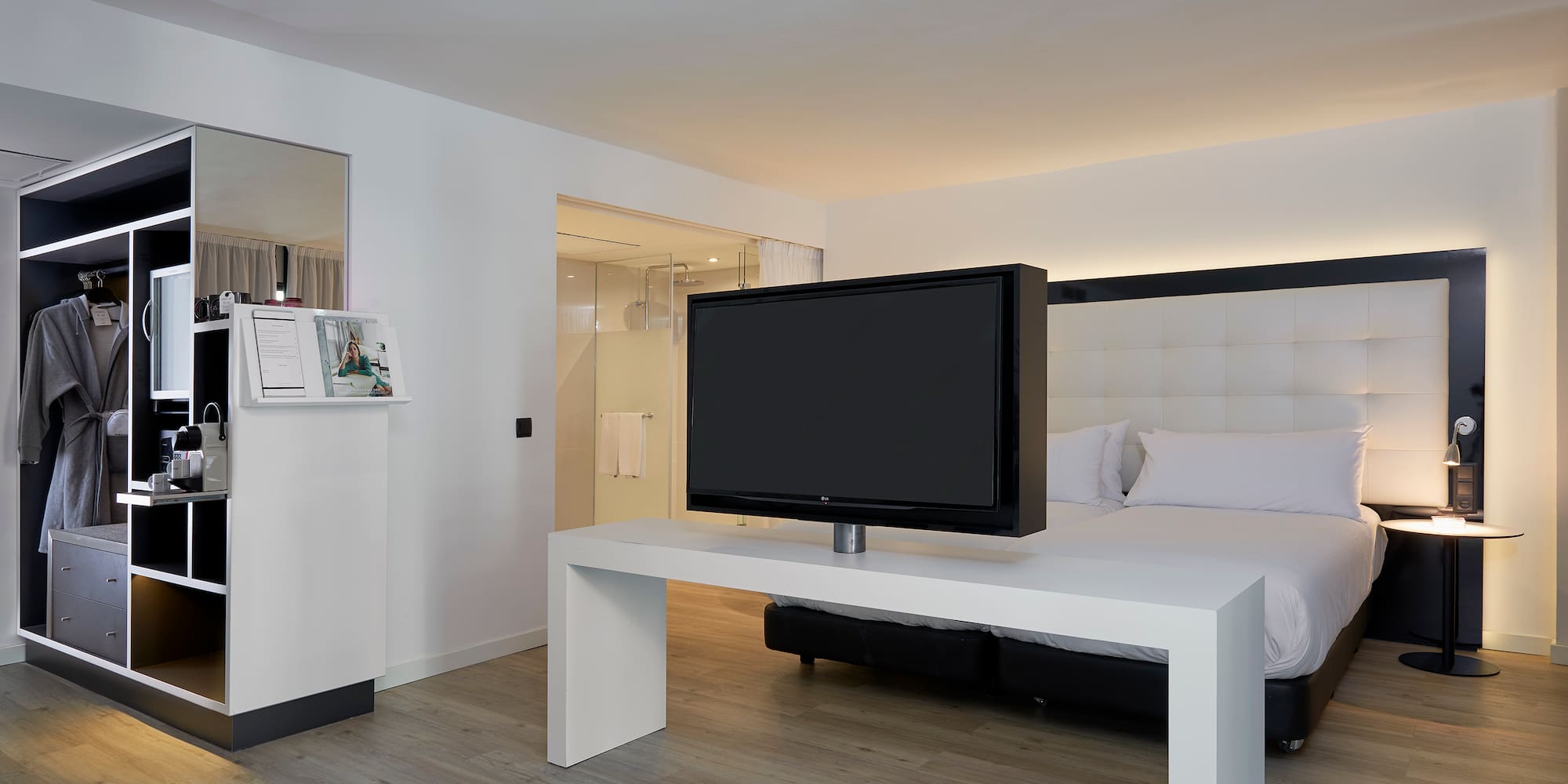 a tv on a table in a hotel room