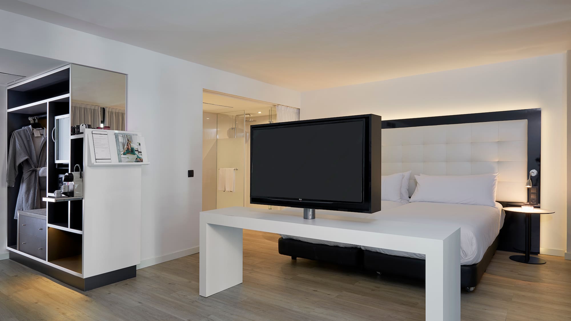 a tv on a table in a hotel room