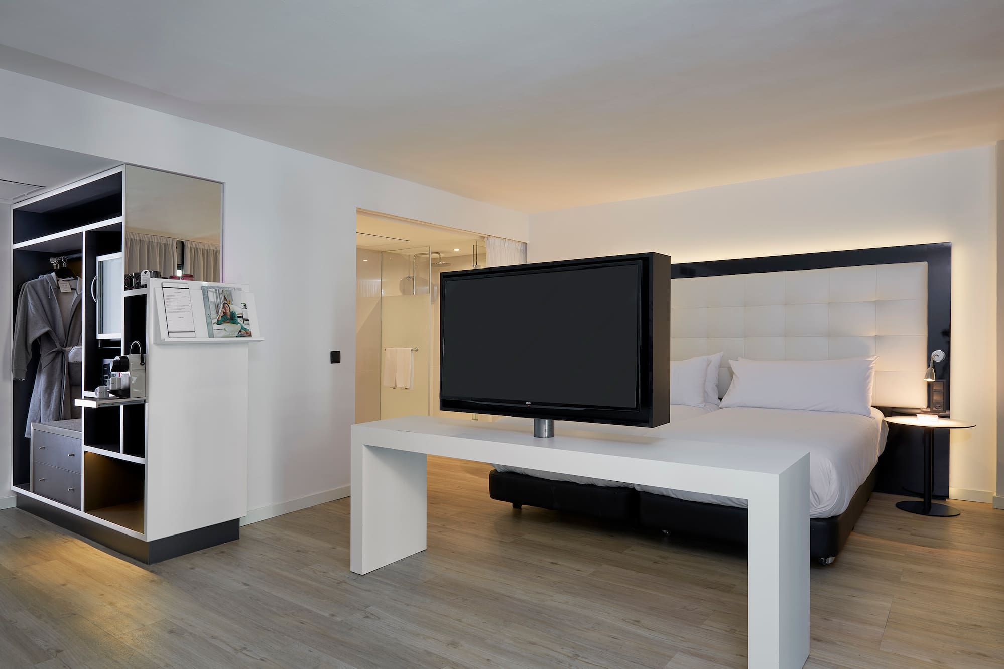 a tv on a table in a hotel room