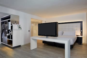 a tv on a table in a hotel room