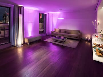a living room with purple lighting