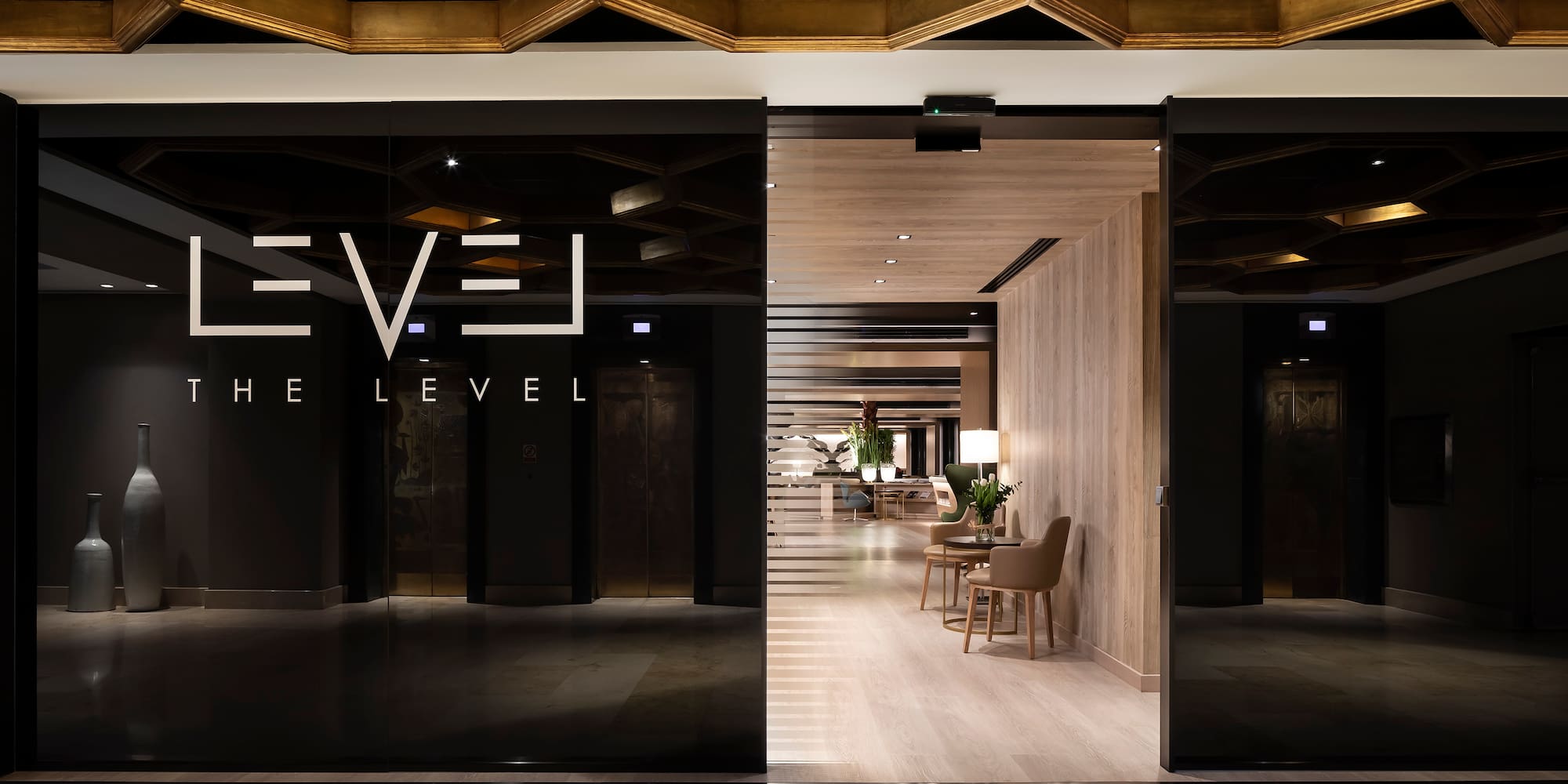 a glass door with a black sign