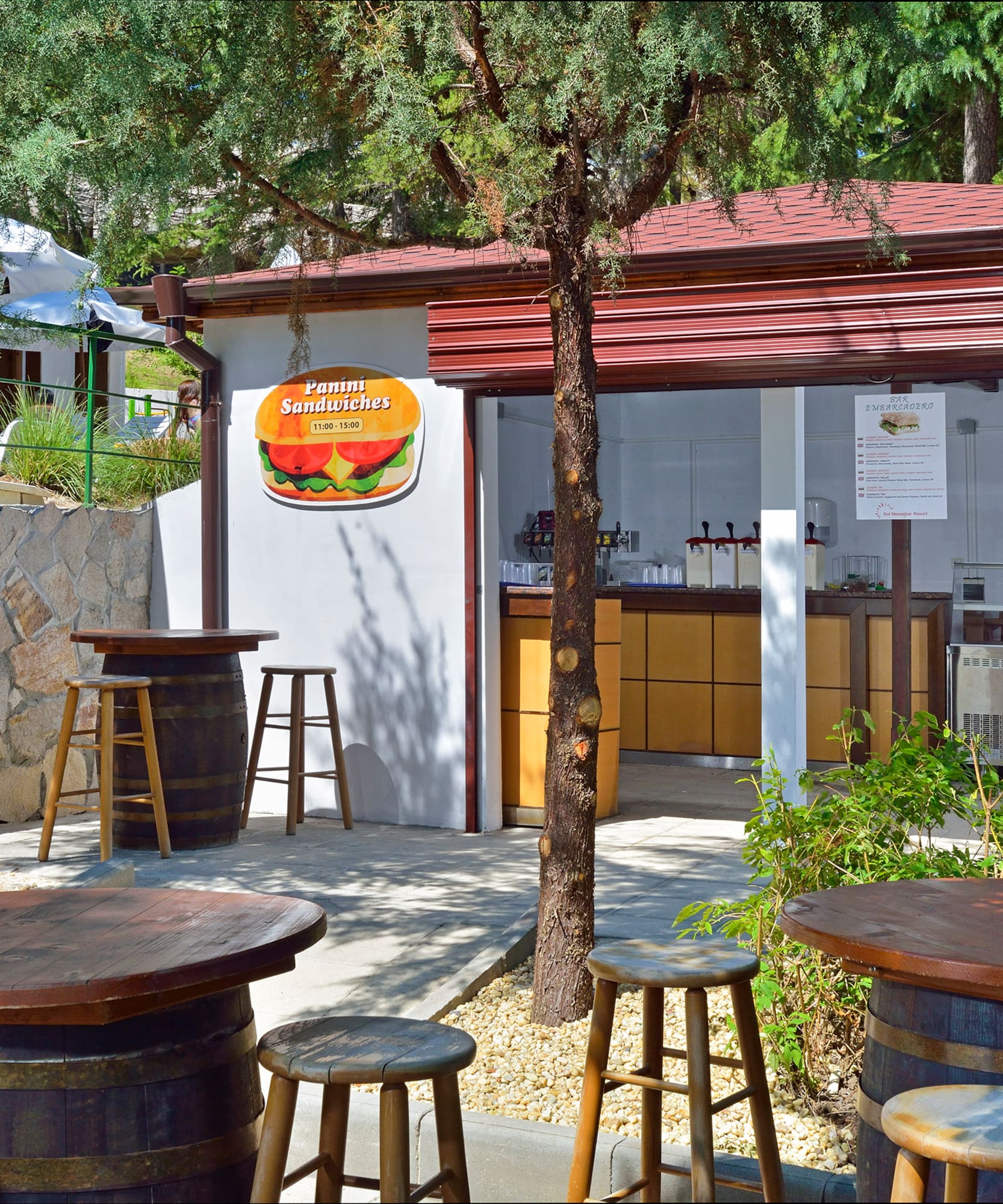 a small building with tables and chairs