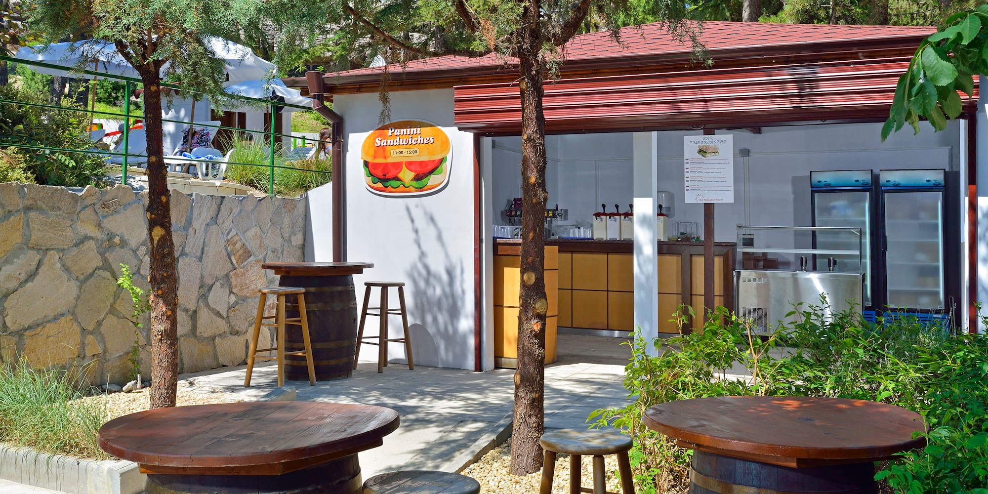 a small building with tables and chairs