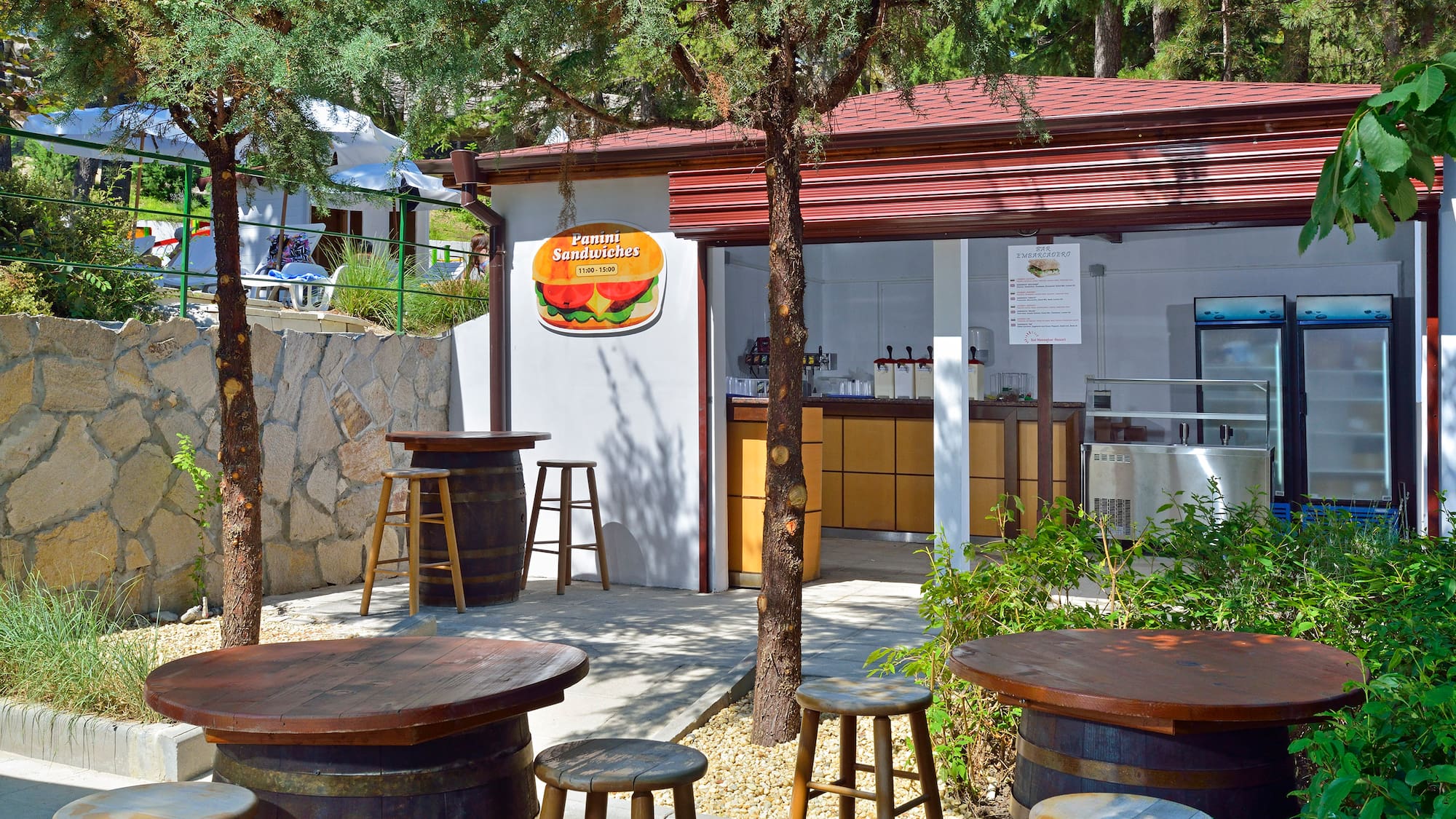 a small building with tables and chairs