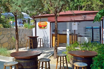 a small building with tables and chairs