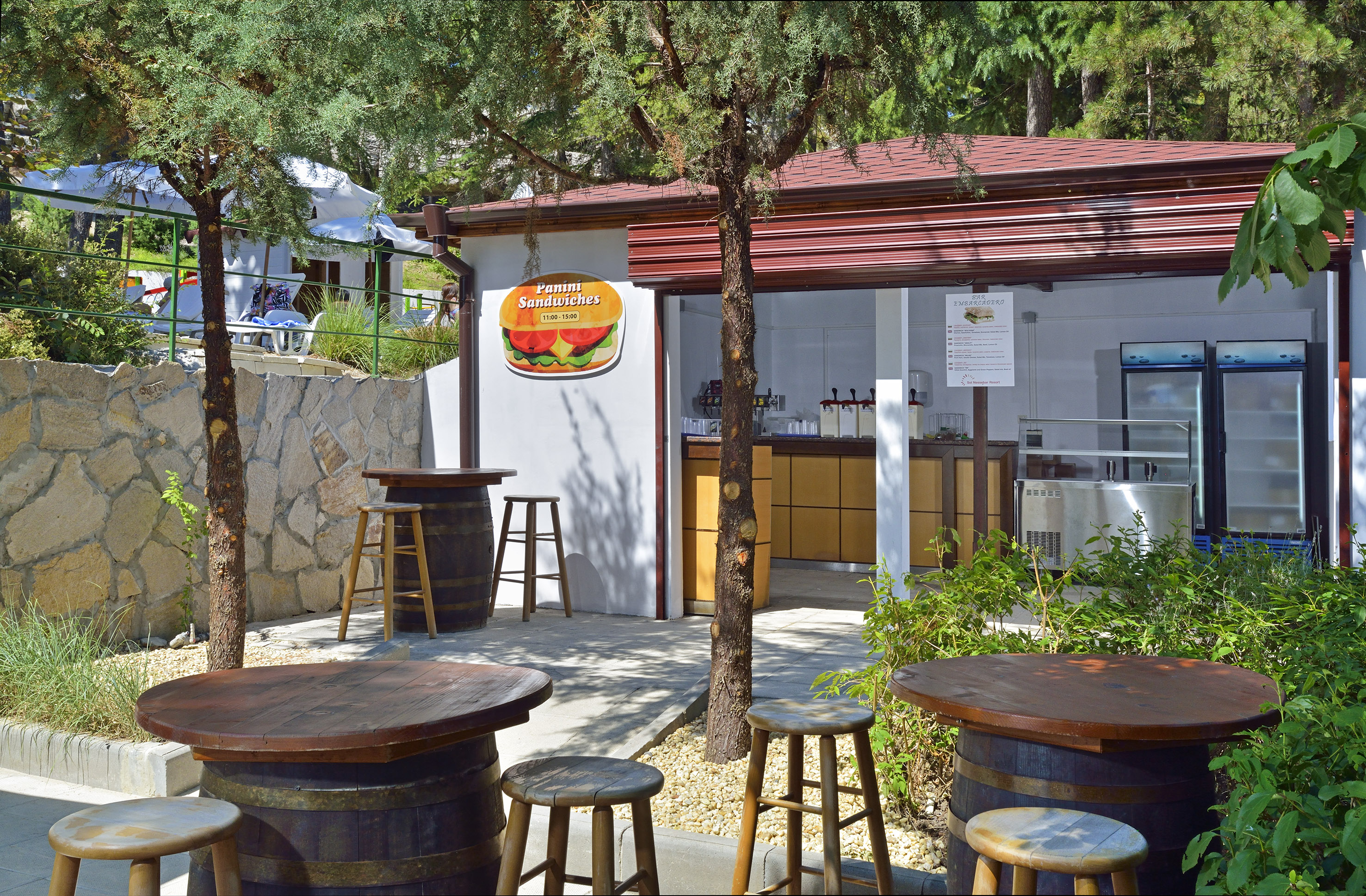 a small building with tables and chairs
