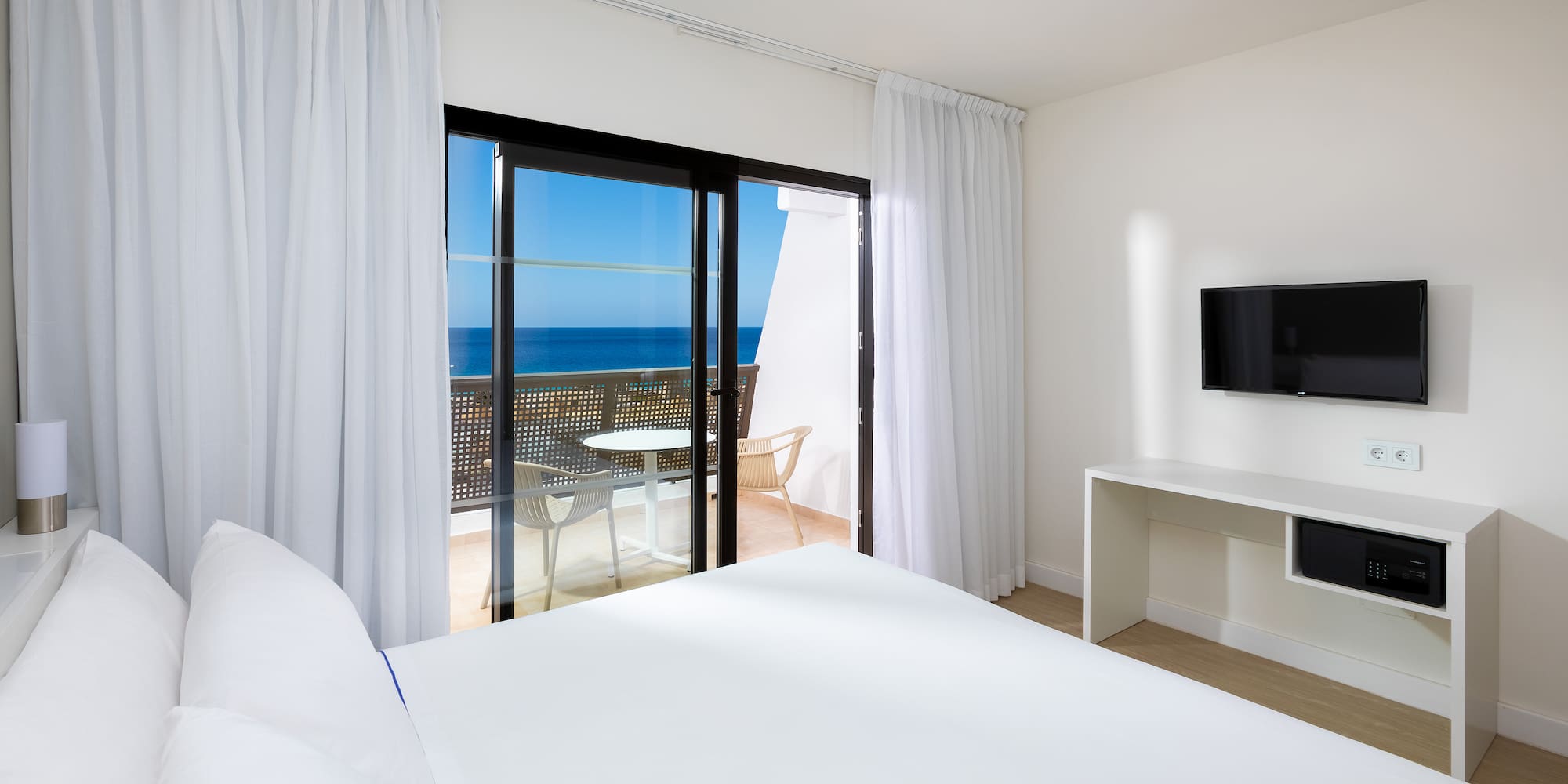 a room with a television and a bed