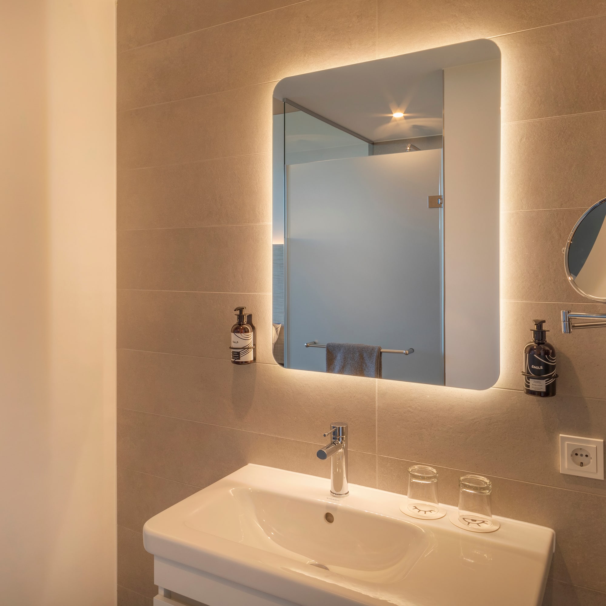 a bathroom with a mirror and sink