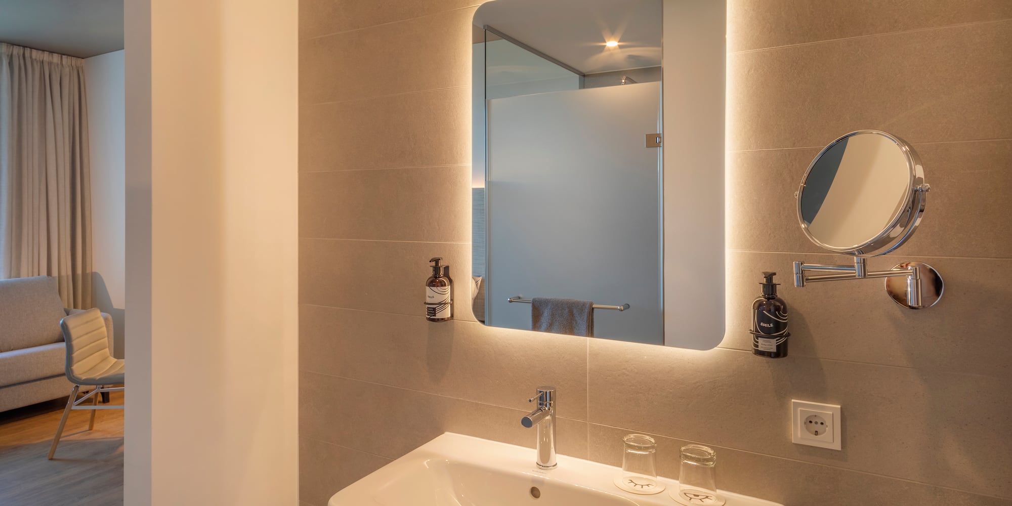 a bathroom with a mirror and sink