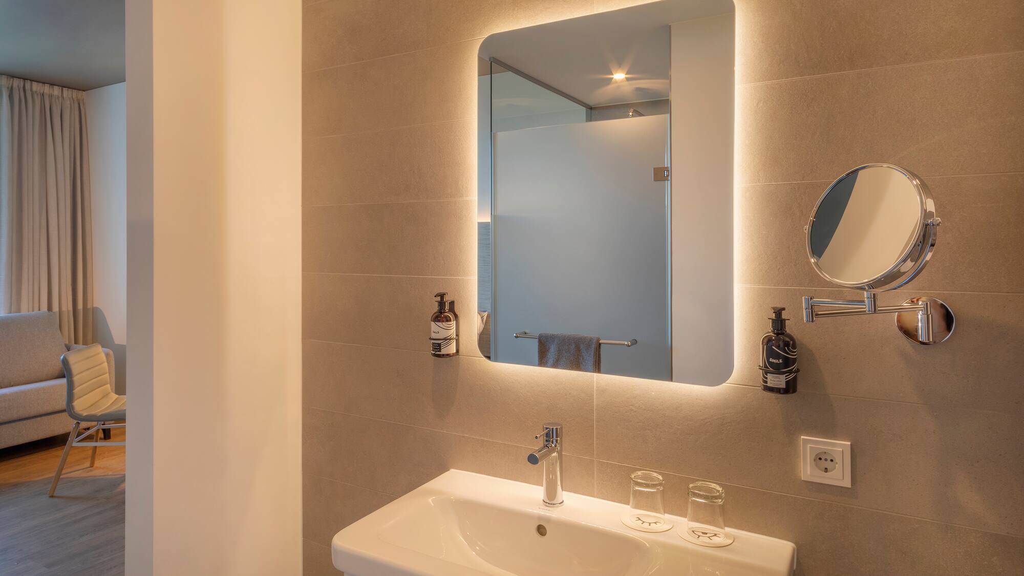 a bathroom with a mirror and sink