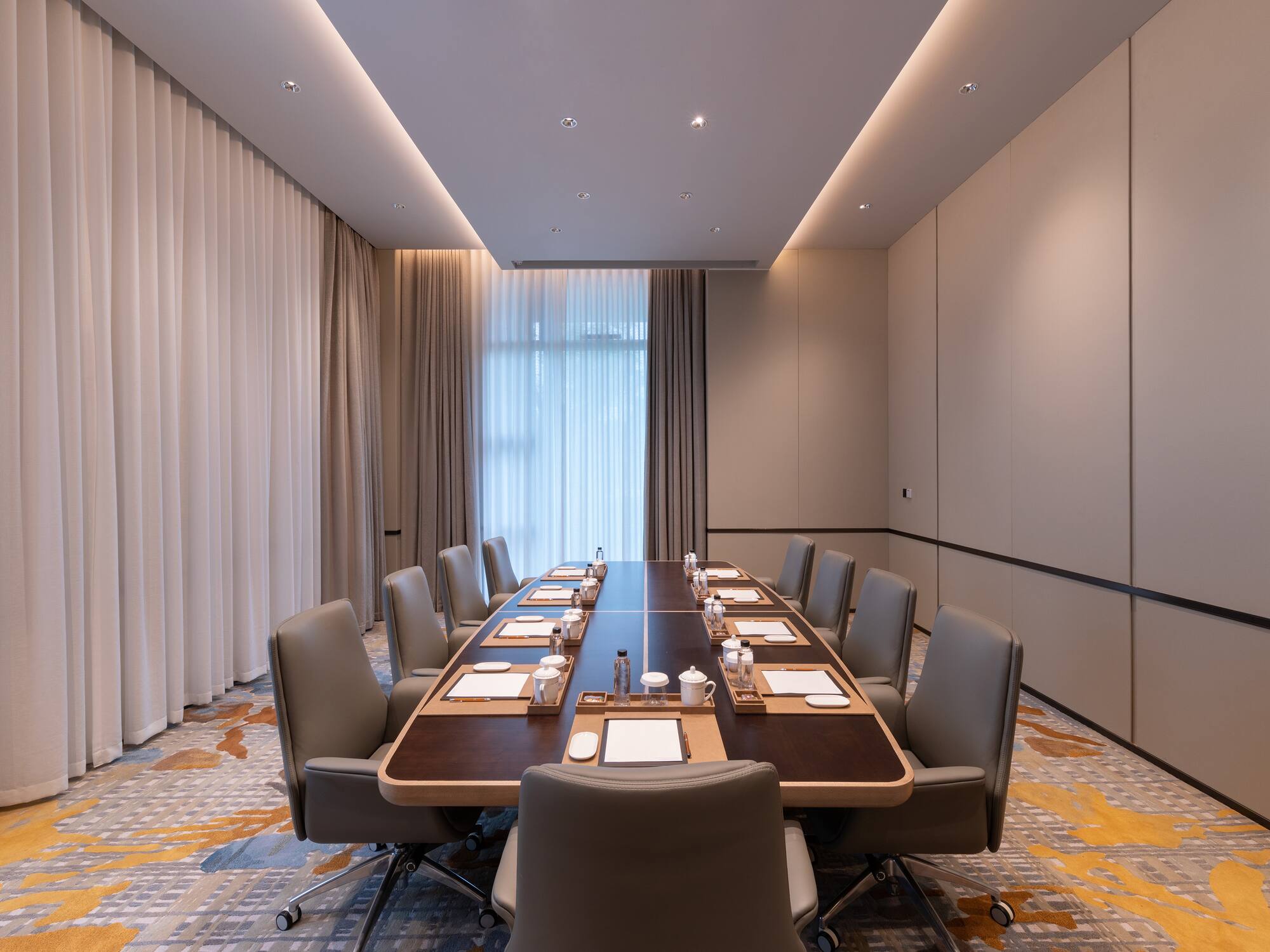 a conference room with a long table and chairs