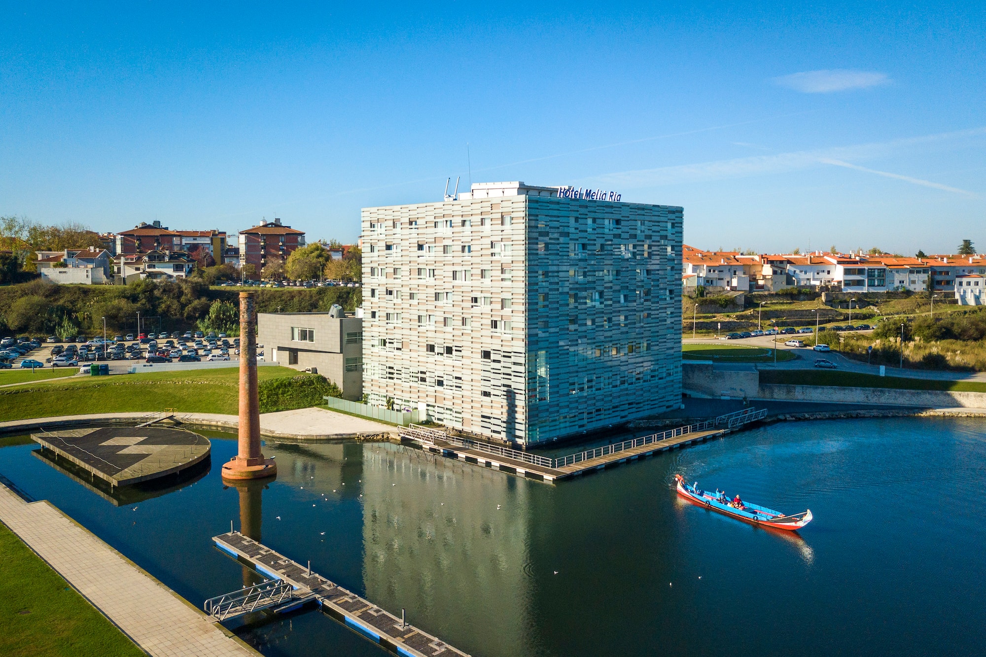 a building next to a body of water