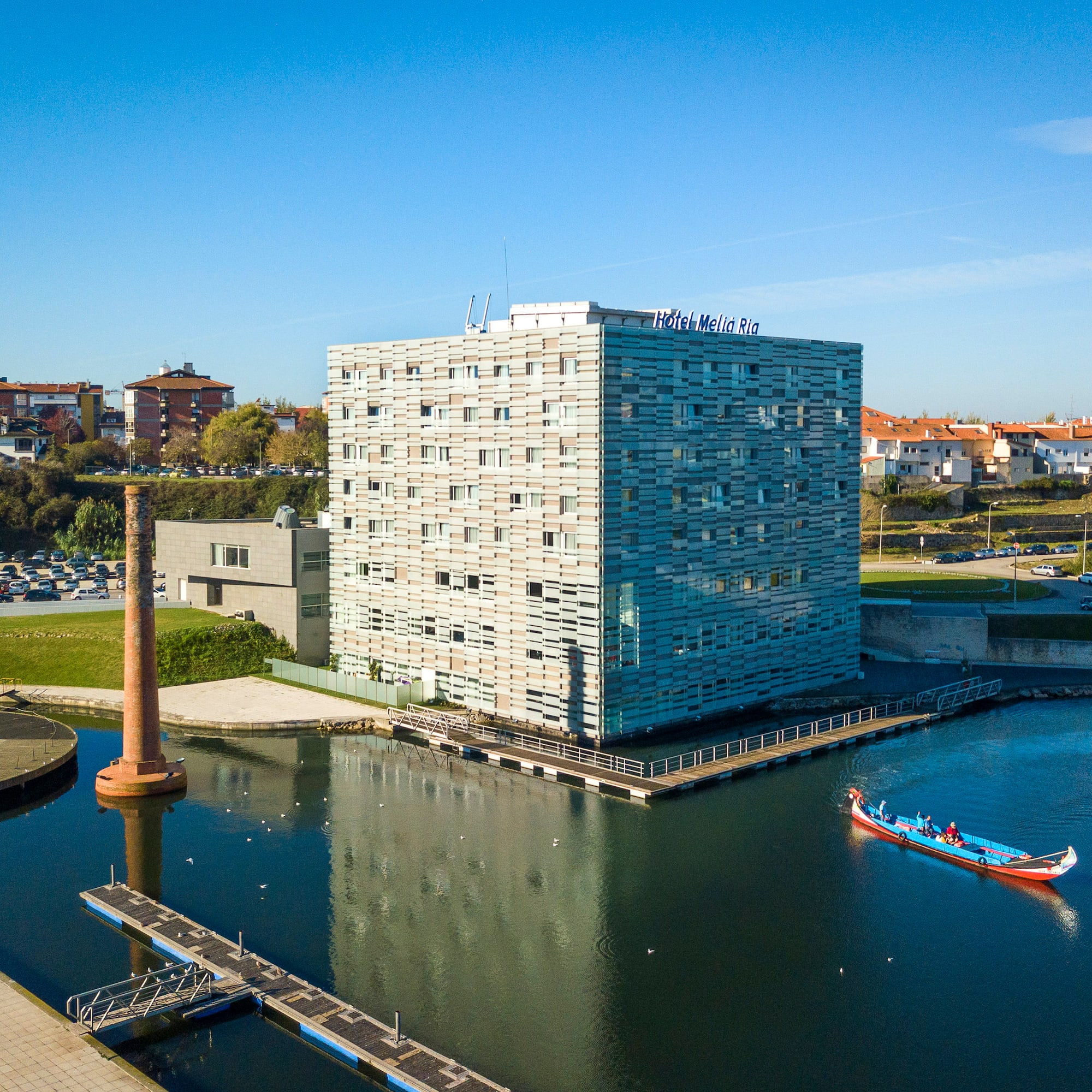 a building next to a body of water