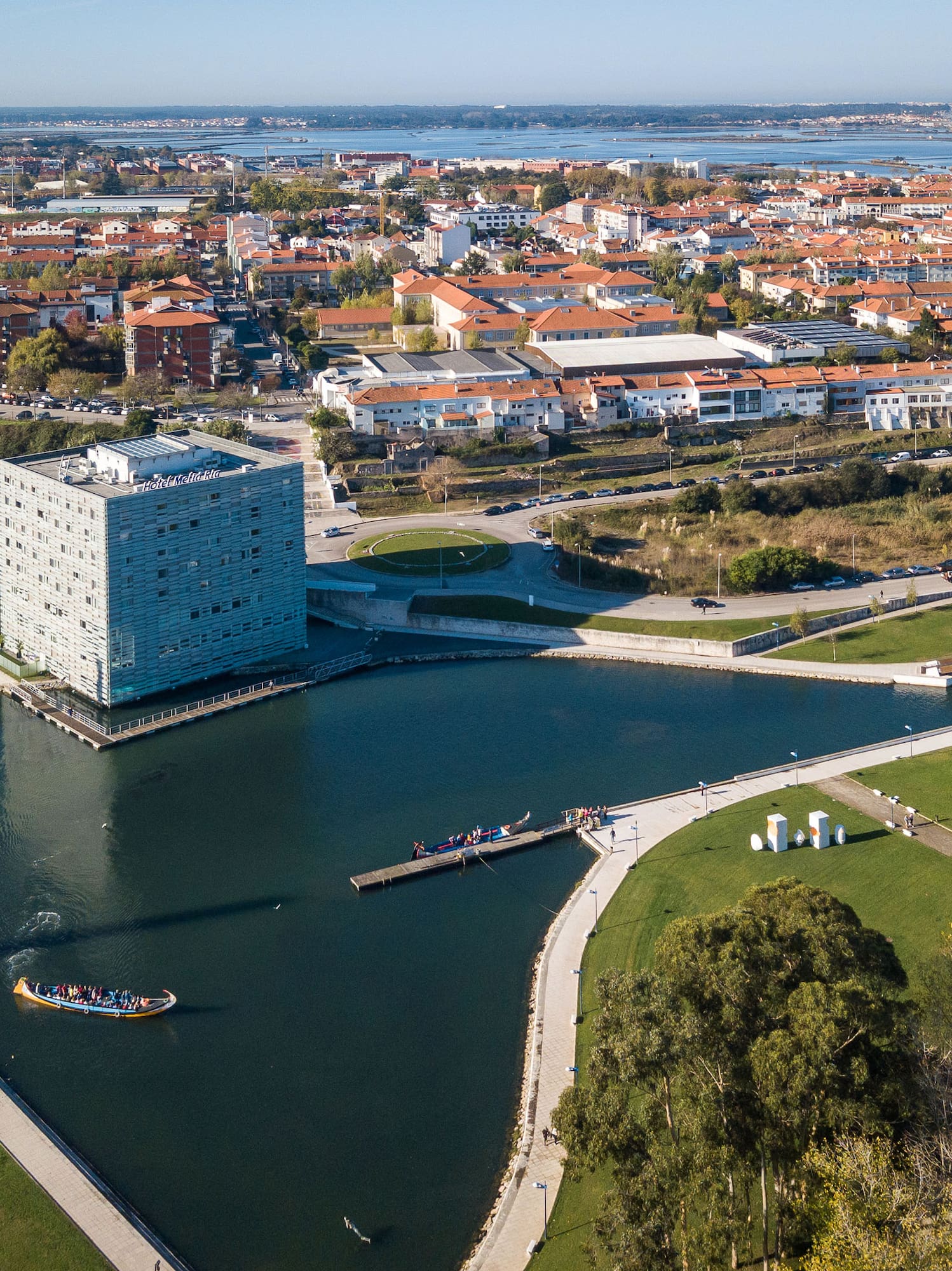 a body of water with a building in the background