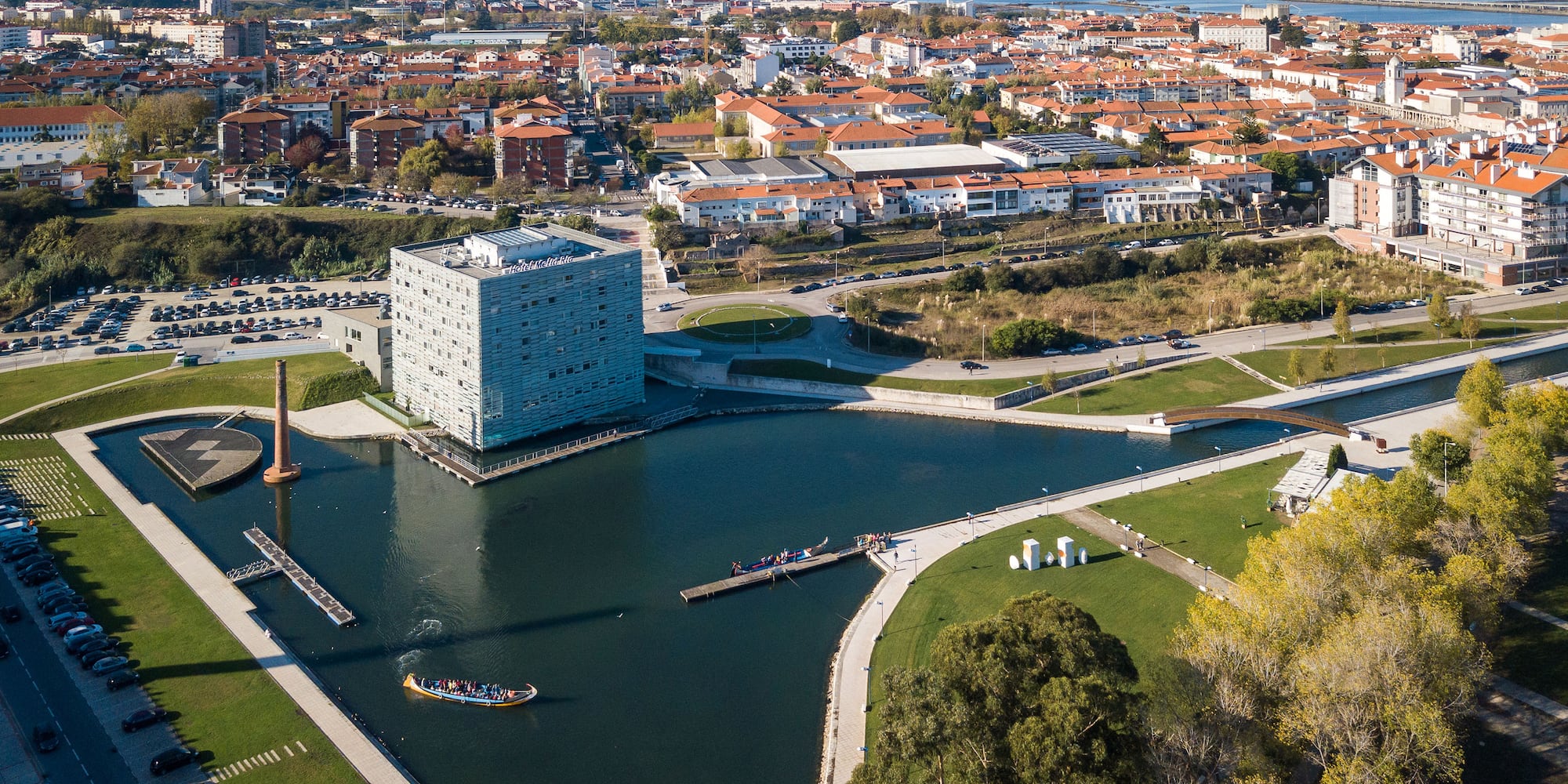 a body of water with a building in the background