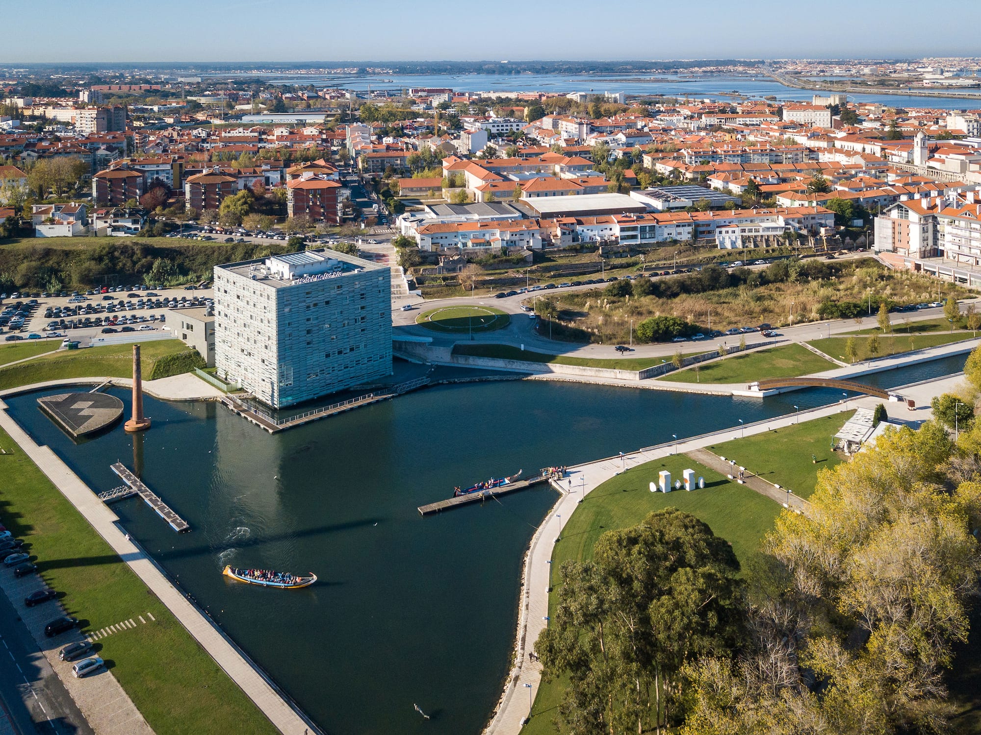 a body of water with a building in the background