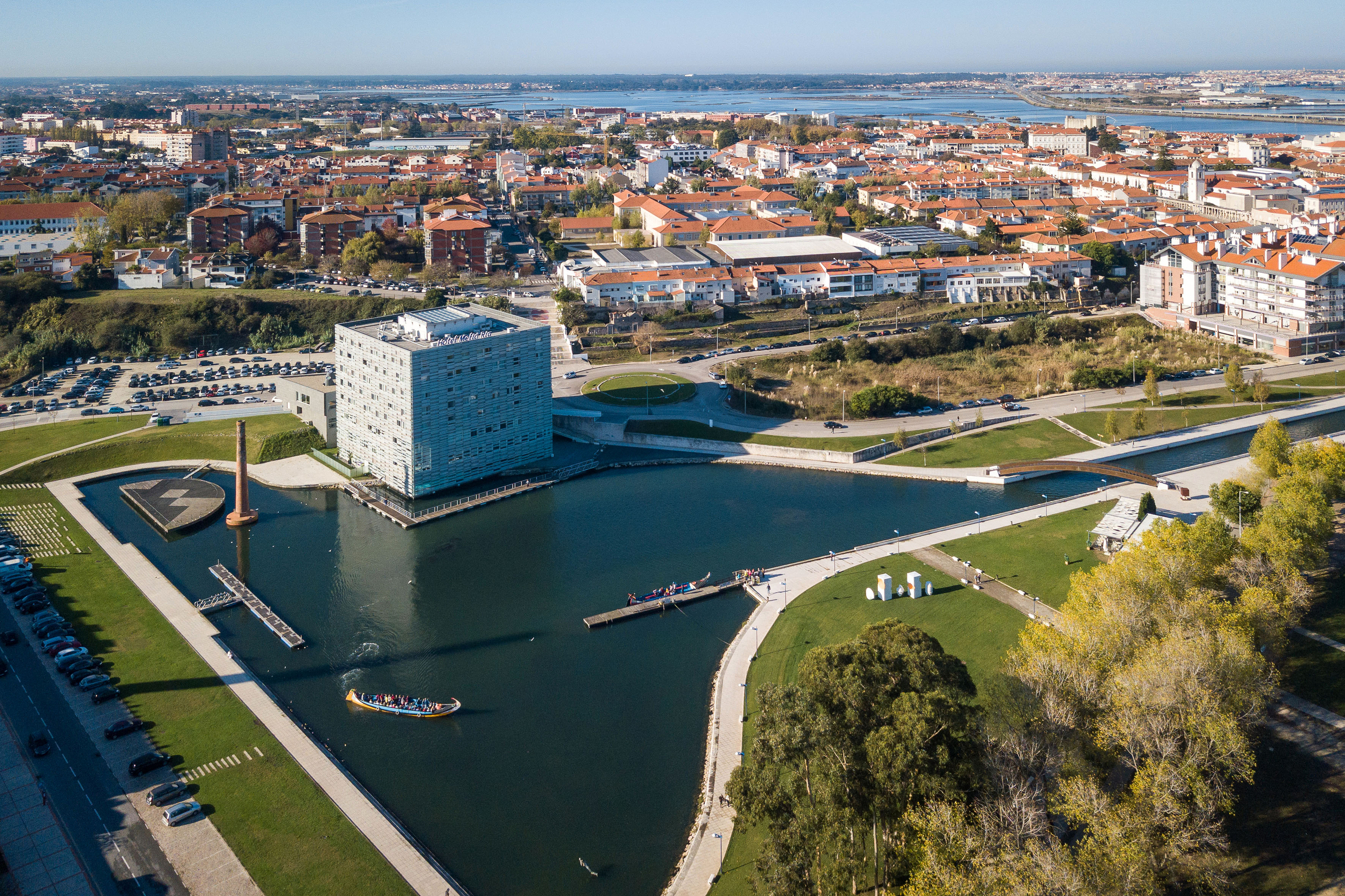 Aerial Aveiro, Portugal: Hotel Meliá Ria, canals, moliceiro boats, urban skyline.