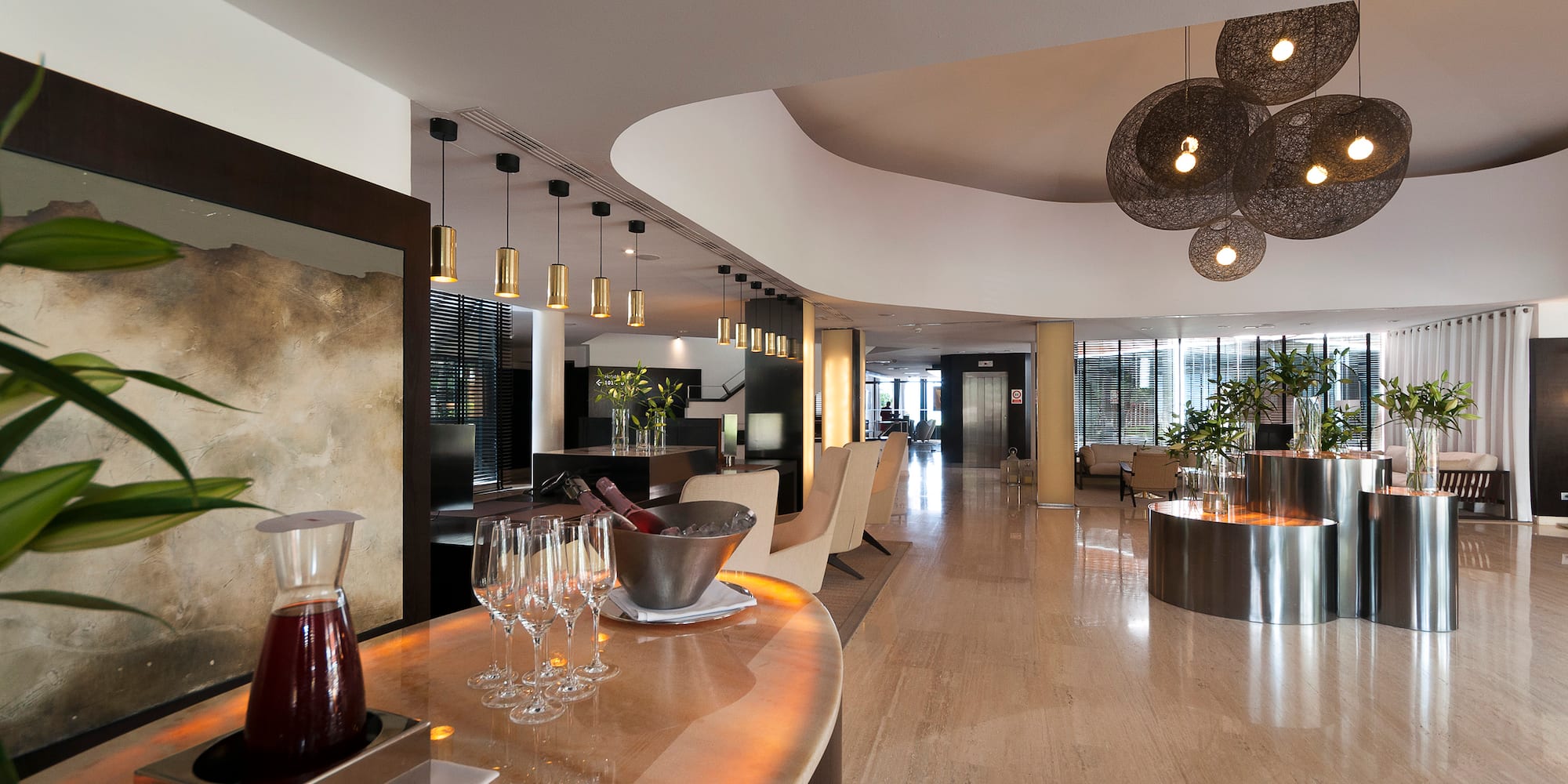 a room with a bar and chairs