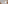 Modern hotel bedroom with king bed, neutral decor, white linens, and balcony.