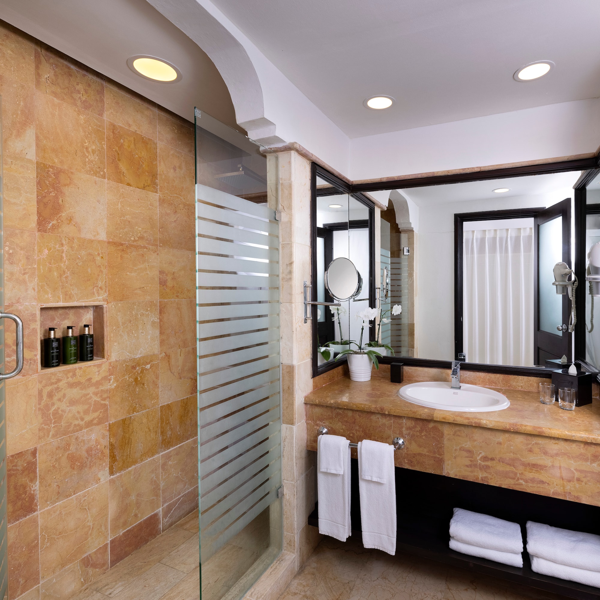 a bathroom with a shower and sink