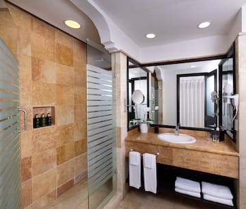 a bathroom with a shower and sink
