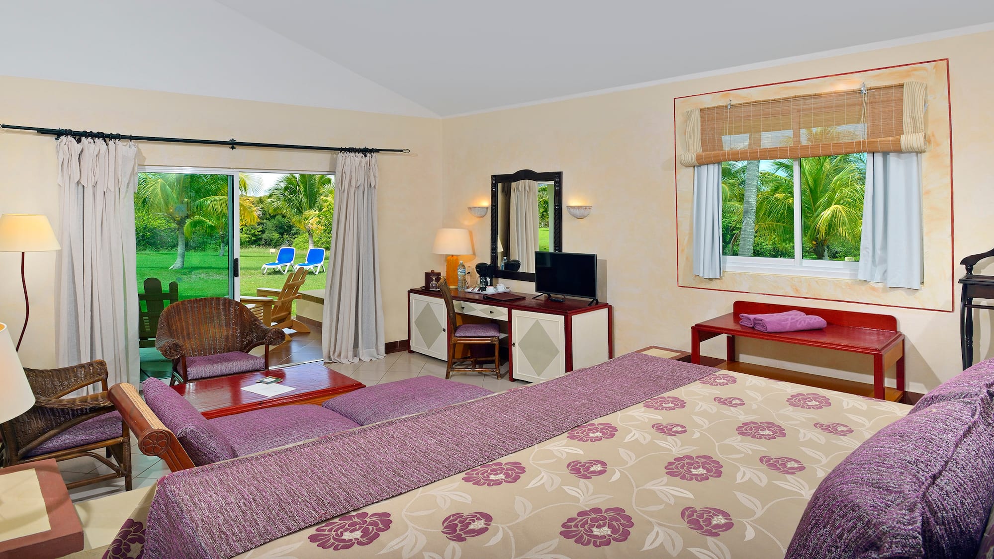 a room with a bed and a television