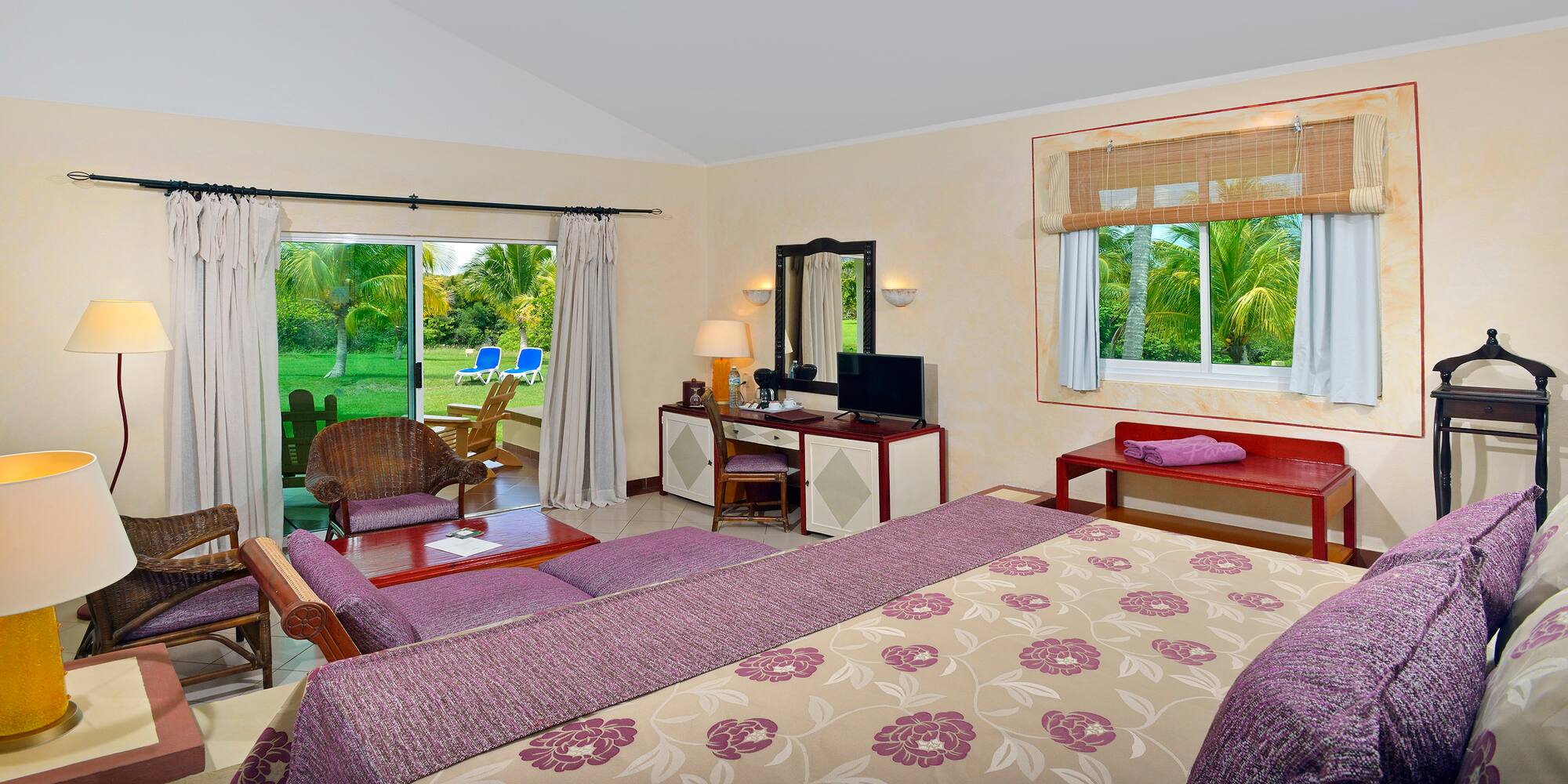 a room with a bed and a television