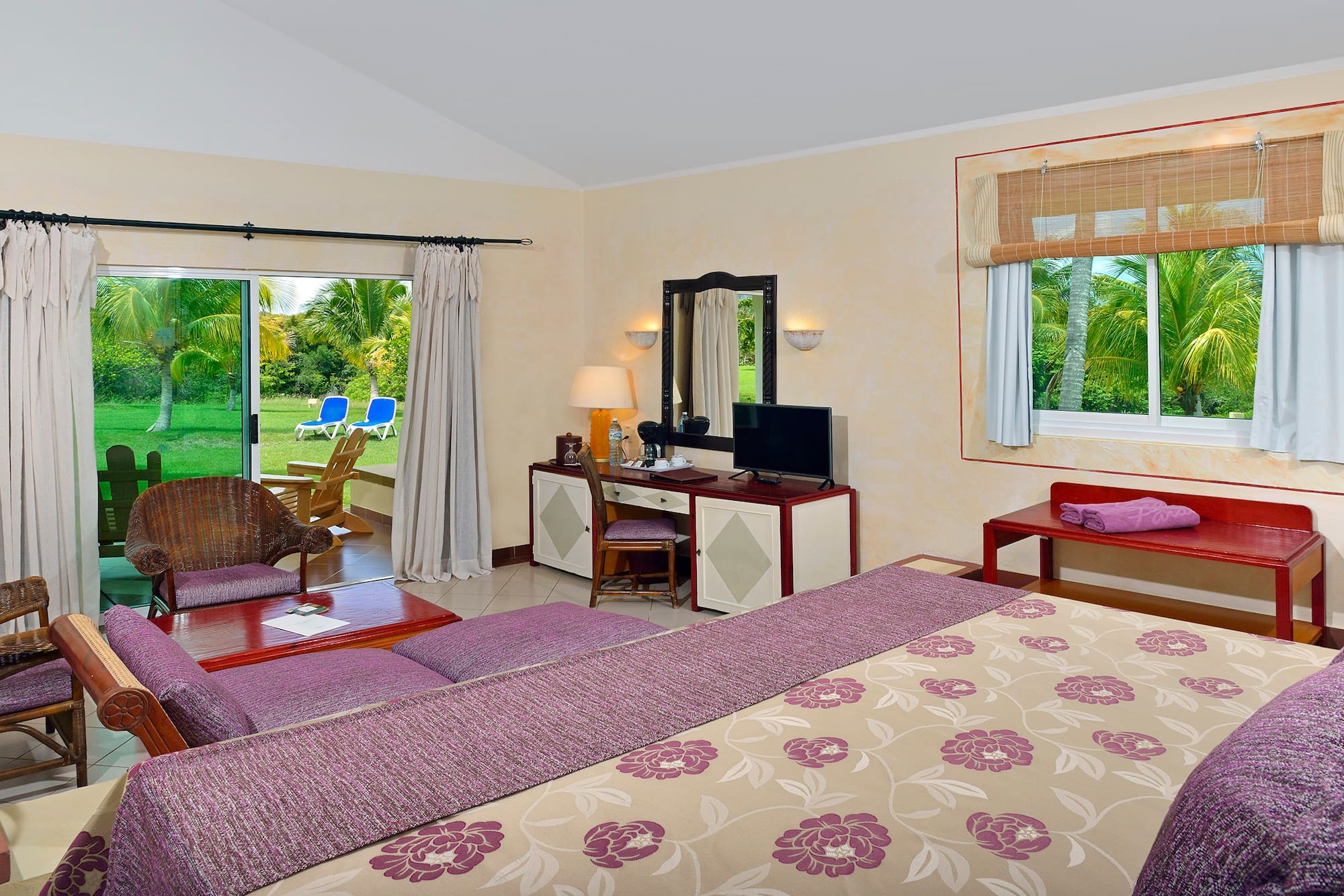 a room with a bed and a television