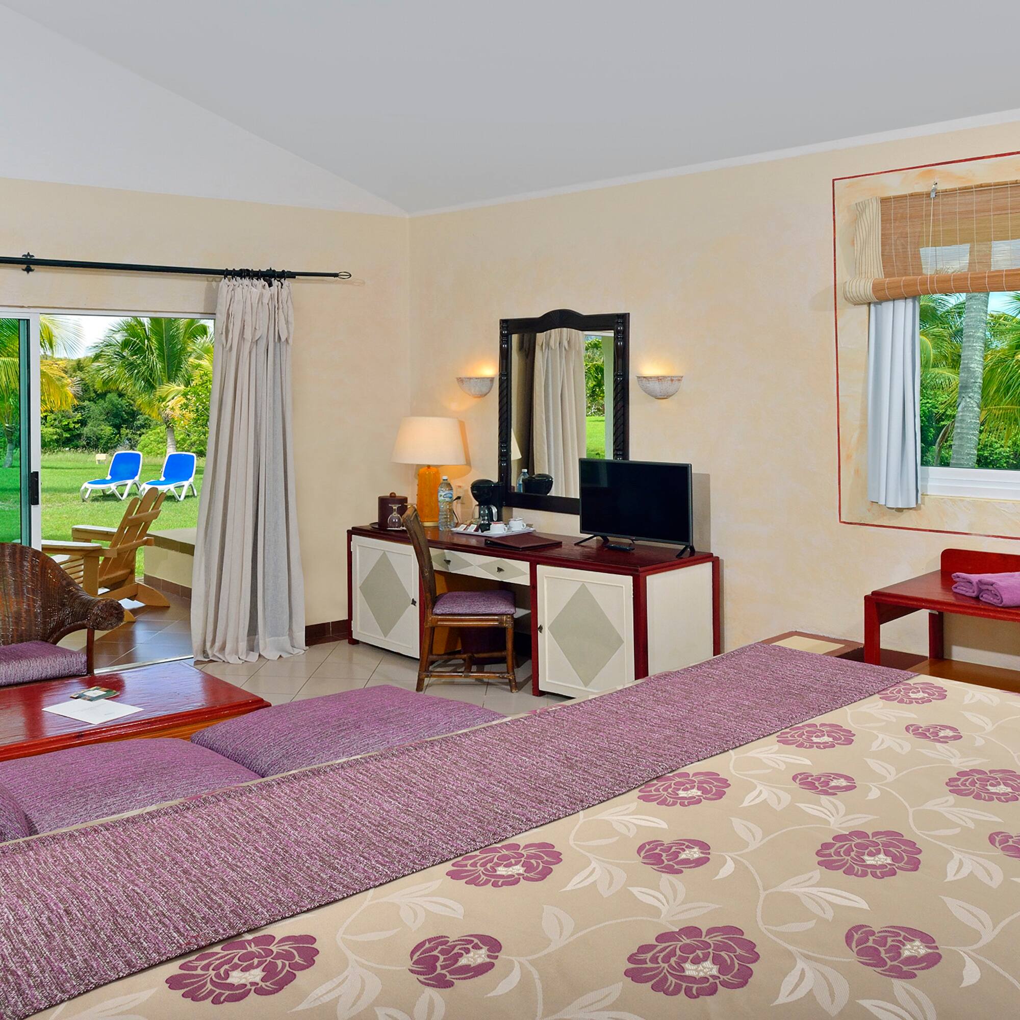 a room with a bed and a television