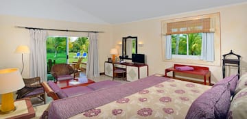 a room with a bed and a television