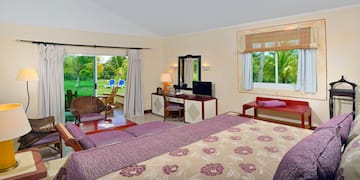 a room with a bed and a television