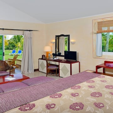 a room with a bed and a television