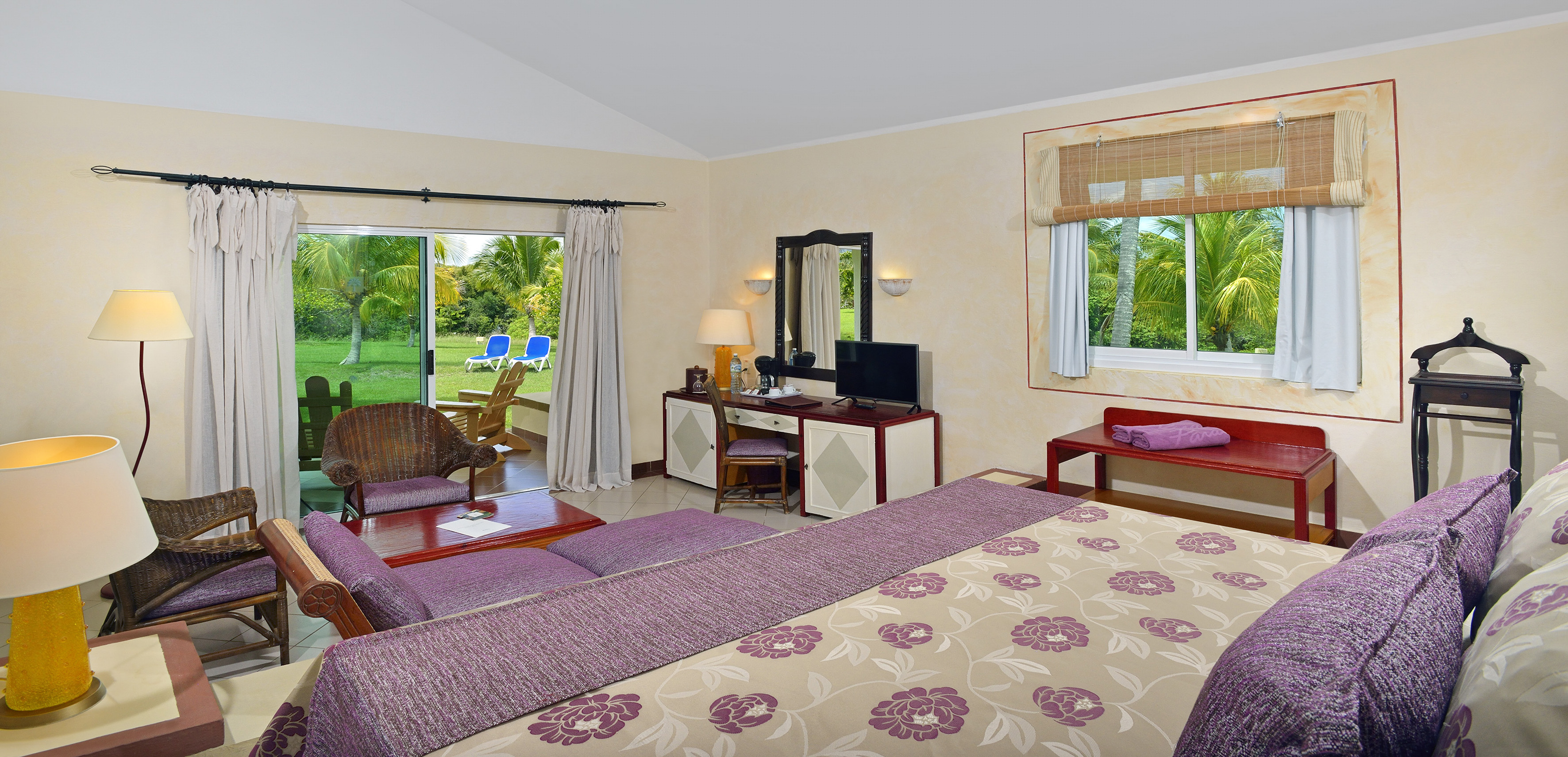 a room with a bed and a television