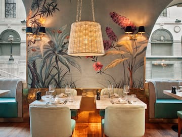 a restaurant with tables and chairs