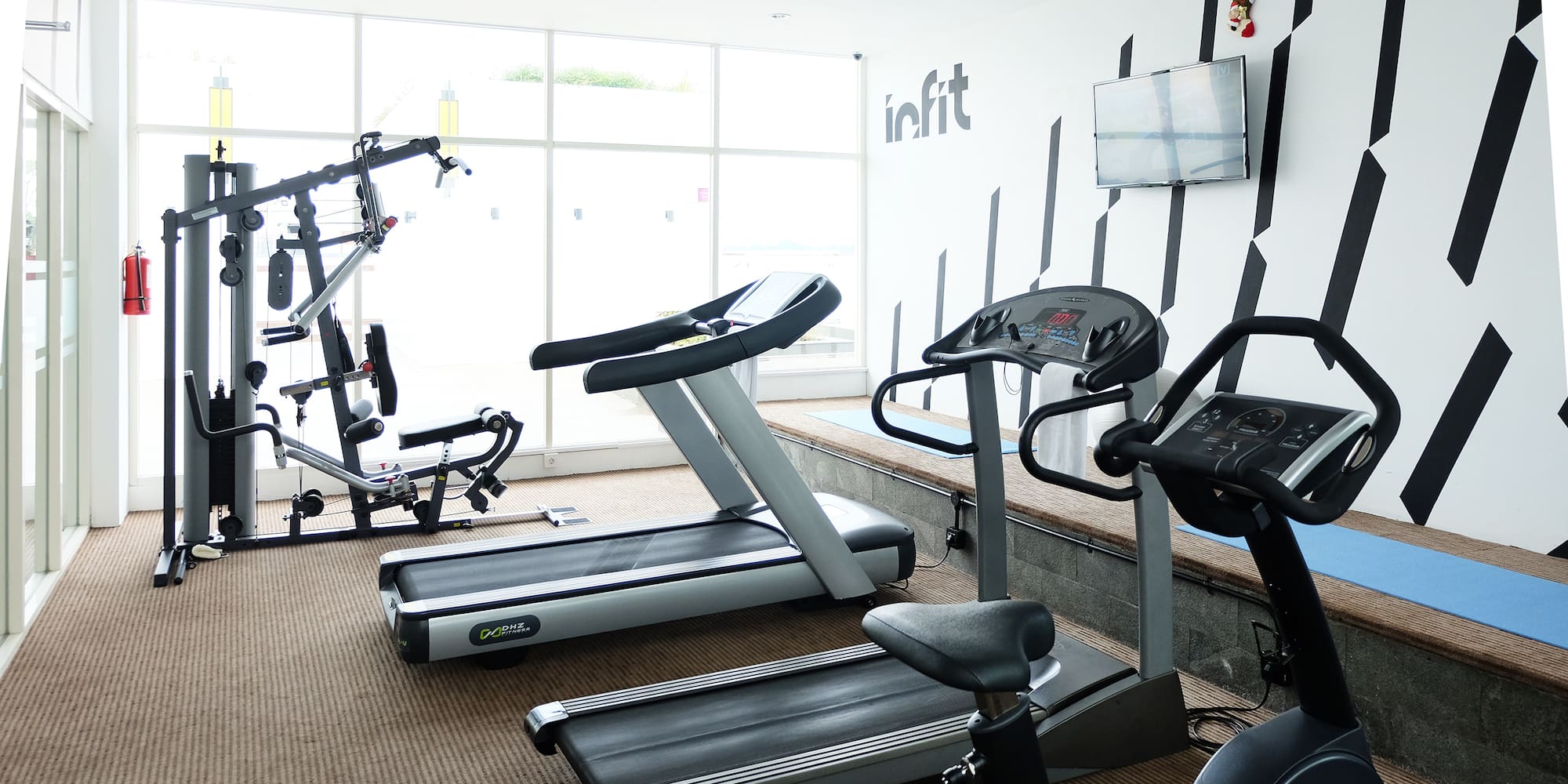 a room with treadmills and exercise machines