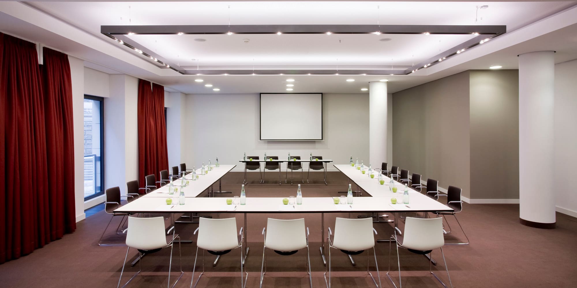a conference room with a large table and chairs