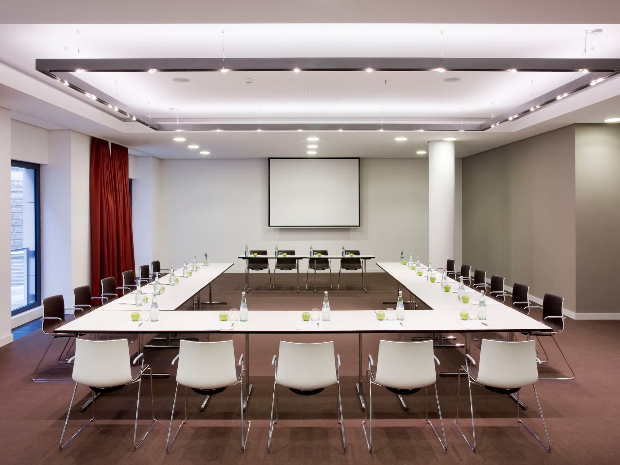 a conference room with a large table and chairs