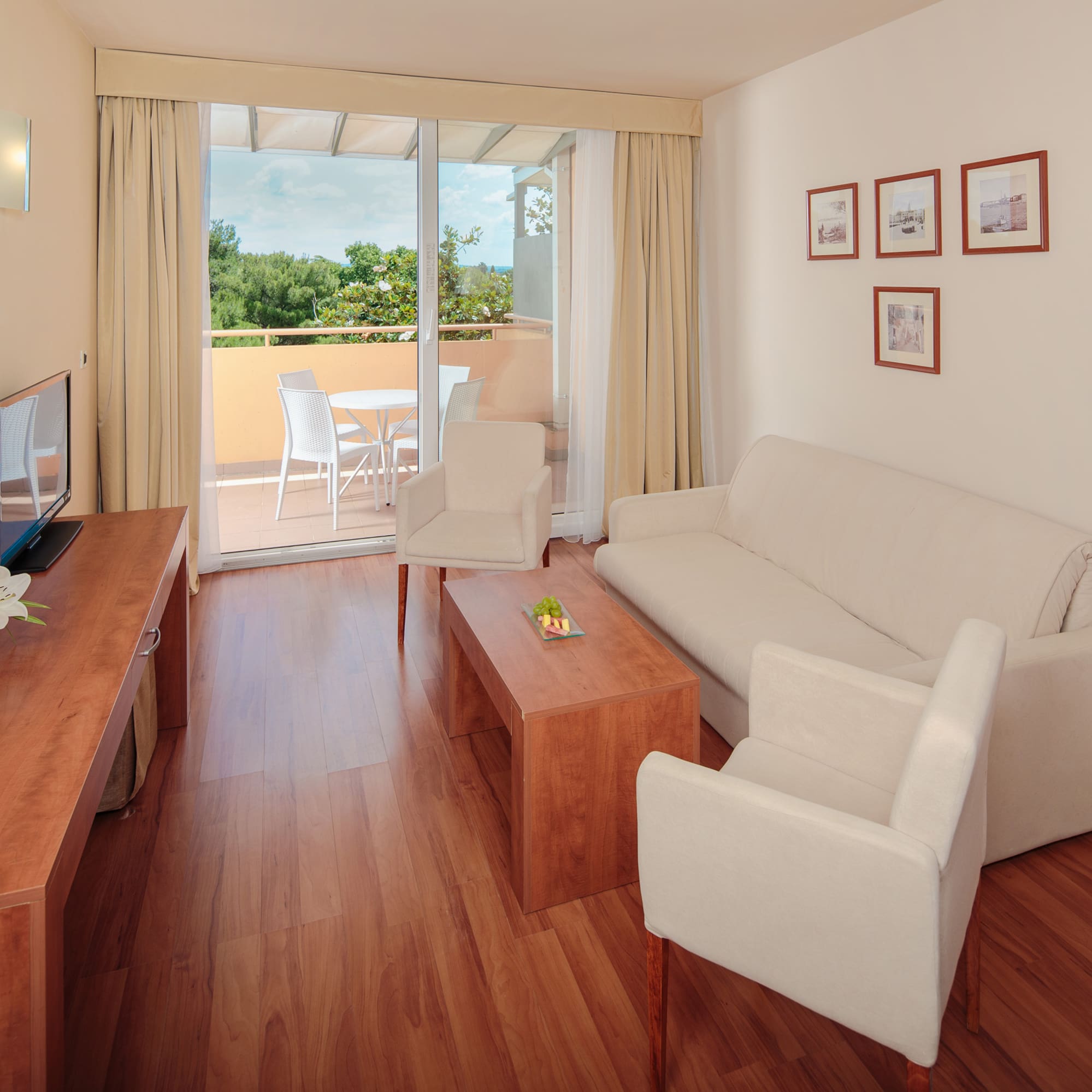 a living room with a television and a couch