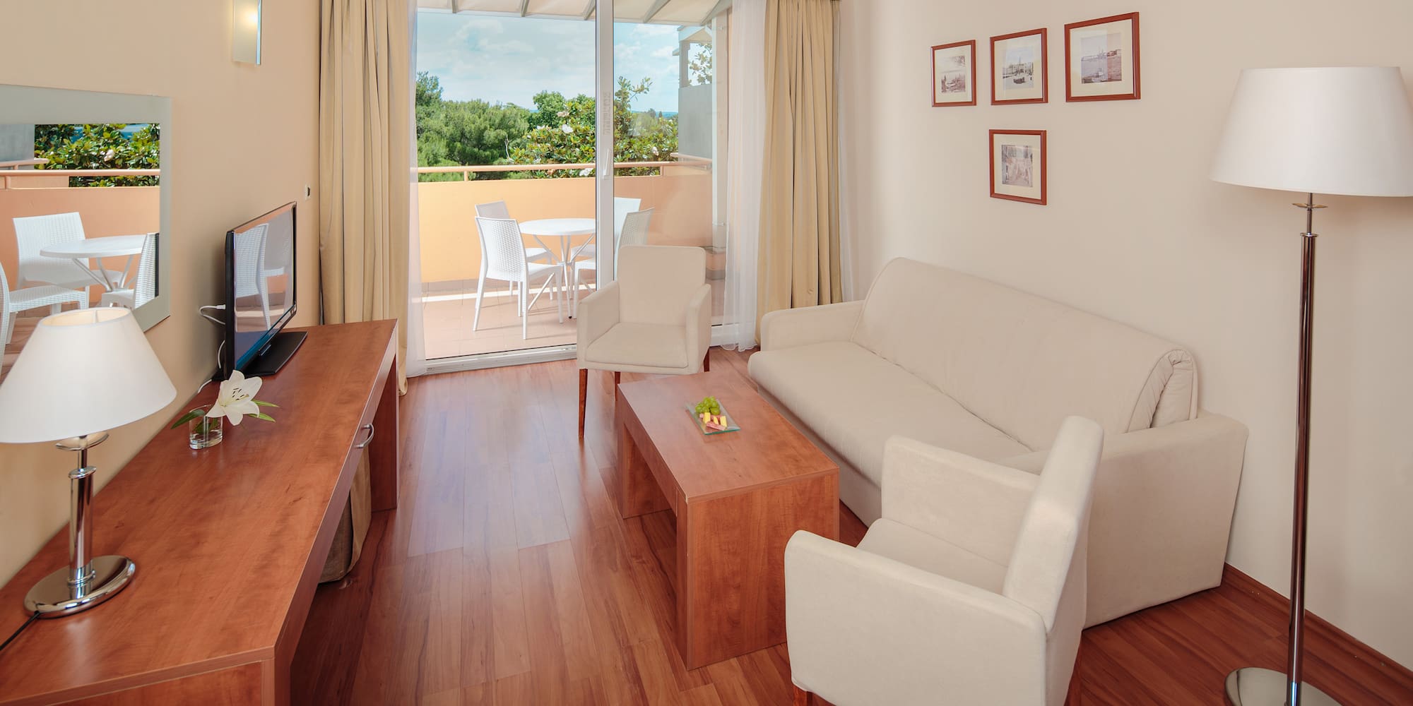 a living room with a television and a couch