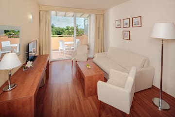 a living room with a television and a couch