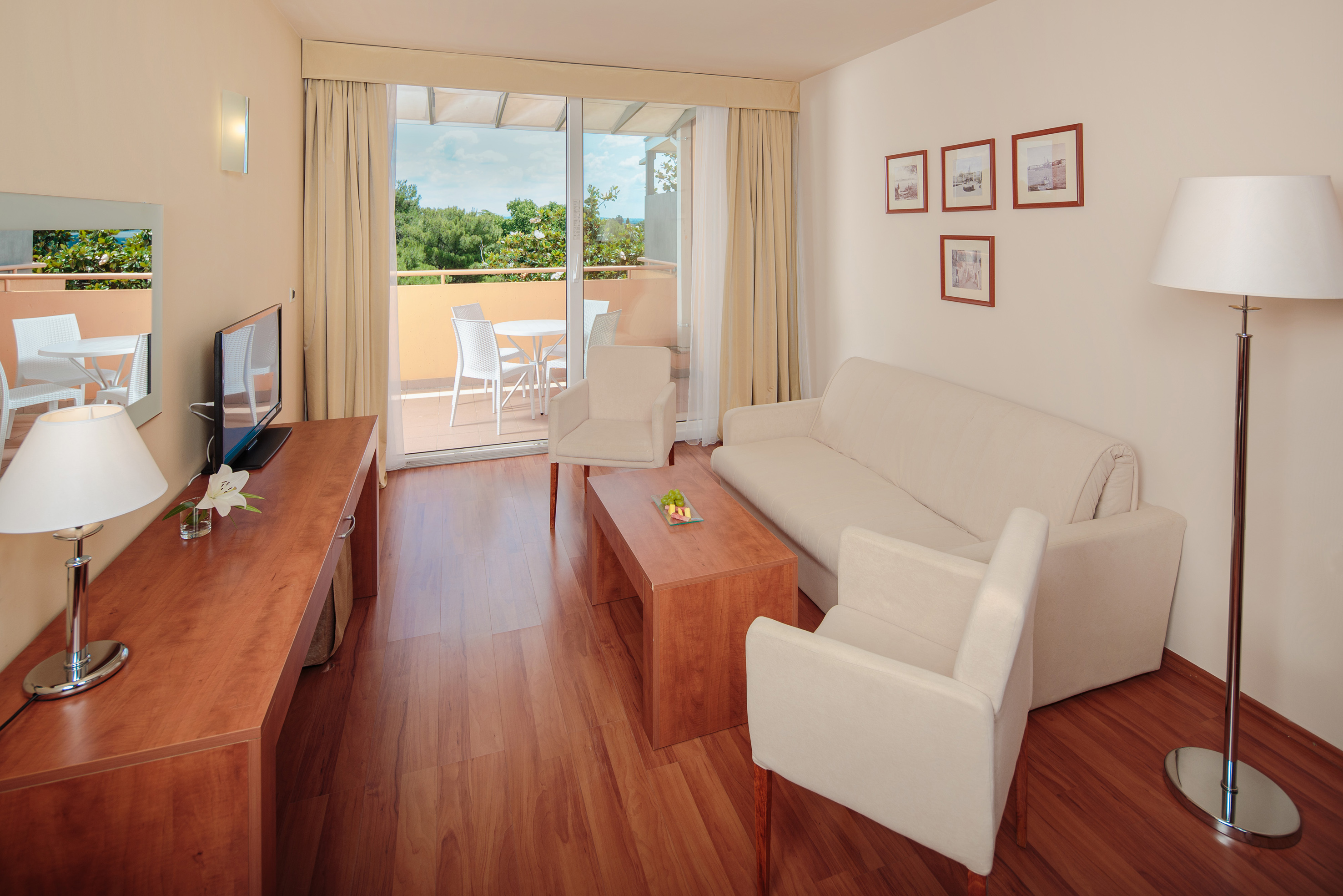 a living room with a television and a couch